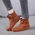 Side view of classic vintage brown leather ankle boots with elegant lace-up detail. - 38 / Yellow