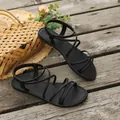 Sandali piatti neri minimalisti con cinturini sottili e cinturino elastico posteriore - 36 / Nero