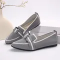 Detailed macro view of comfortable grey knit flat shoes with pointed toe and bow accent. - 36 / Gray