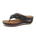 Vista lateral de chanclas de cuña para mujer con tres flores decorativas y suela gruesa. - 36 / Negro