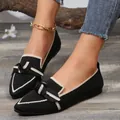 Close-up of elegant black pointed-toe flats with cream bow detail and breathable knit fabric. - 36 / Black