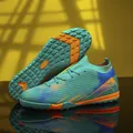 Turquoise fly-knit voetbalschoenen met oranje accenten en TF-trainingszool - 36 / Turf Noppen (TF) / Turquoise Groen