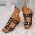 Close-up of black platform sandals with gold rectangular buckles and hollow-out design - 36 / Black