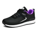 Lightweight black fly-knit athletic sneakers featuring purple lining and white sole - Black and Purple for Women
