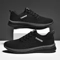 Breathable black fly-knit running shoes with lightweight mesh and stylish lace-up design - 38 / Black and Gray