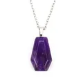 Close-up detail showing the natural texture of a purple crystal coffin shaped pendant - Purple Crystal