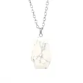 Close-up of a white marble coffin pendant necklace with a fine silver-tone chain. - Howlite