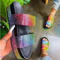 Macro view of rainbow rhinestone platform sandals with sparkling crystal straps. - 35 / Colorful