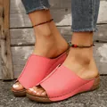 Detail view of pink wedge sandals with thick soles and white stitching accents - 36 / Pink