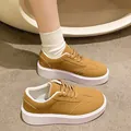 Side view detail of mustard yellow retro canvas platform sneakers with thick white soles. - 36 / Bright yellow