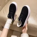 Detail view of stylish black suede platform sneakers for women in a retro style - 36 / Black
