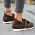 Detailed view of brown breathable flyknit mesh sneakers with stylish red heel pull tabs - 36 / Dark Brown