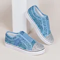 Macro view of blue and silver glitter women's loafers featuring sparkling sequin texture - 36 / Blue
