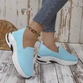 Close-up of light blue fly-knit mesh women's slip-on sneakers with thick sole - 36 / Sky Blue