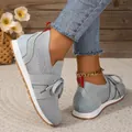 Close-up of grey breathable knitted lace-up sneakers for women with red pull tab - 36 / Gray