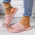 Detail view of pink corduroy plush slippers with braided trim and soft indoor warm sole. - 36-37 / Pink