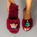 Close-up detail of burgundy plush Christmas slippers featuring reindeer and tree ornaments - 36-37 / Burgundy