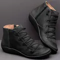 Stylish black women's leather ankle boots with flat sole and side zipper design - 35 / Black