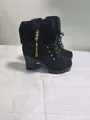 Side view of black high heel boots featuring faux fur trim and gold tassel detail. - 35 / Black