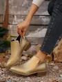 Stylish pointed-toe Chelsea ankle boots for women in elegant metallic gold finish - Gold