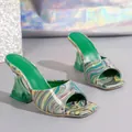 Detailed view of women's square toe mules with marble pattern and green crystal heels - 36 / Green
