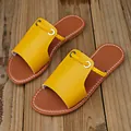 Gele zomerse damesslippers met gevlochten koorddetail en bruin voetbed - 38 / Geweven Platte Slippers / Geel