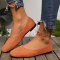 Detailed side view of orange suede square toe loafers for women on wooden floor - 36 / Orange
