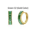 Front and side detail of emerald green baguette zircon gold plated huggie earrings. - Gold / Green