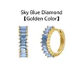 Detailed view of gold plated huggie hoop earrings featuring baguette-cut sky blue zircons - Gold / Sky Blue