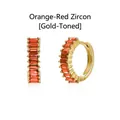 Detail view of gold hoop earrings featuring orange baguette-cut zircon - Gold / Orange Red