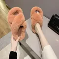 Cross-strap faux fur slippers for women in a warm coral pink for winter home wear. - Orange