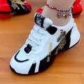 Detailed close-up of white chunky sneakers with golden tiger embroidery details - 35 / Lucky Tiger Embroidery Style (A8939) / White