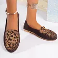 Detailed view of women's leopard print slip-on loafers featuring dark brown suede. - 35 / Brown Leopard Print