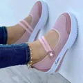 Detalle de cerca de zapatos planos de malla rosa con correas elásticas y estrella - 35 / Rosa