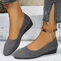 Close-up of stylish gray faux suede wedge pumps featuring a comfortable low heel design - 36 / Gray Plain