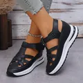 Close-up detail of women's black platform Roman sandals with Velcro straps and hollow-out design - 35 / Black