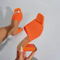 Close-up of vibrant orange knitted high-heel mules with a stylish square toe design. - 38 / Ankle Strap / Orange