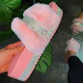 Pink platform slippers featuring luxury faux fur and sparkly rhinestone detailing. - 35 / Pink