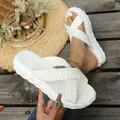 Detailed macro view of white woven straps and textured sole on chic summer slippers - 35 / White