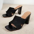 Elegant black fly-knit chunky heel slides with a modern square toe design. - 38 / Criss-Cross Straps / Black