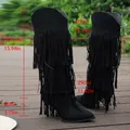 Detailed measurements of black fringe tall boots including shaft height and heel. - Black
