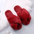 Close-up of red faux fur criss-cross slippers with soft warm plush texture details. - 36 / Burgundy
