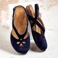 Detail of navy blue suede flat sandals with hollow-out floral pattern and slingback - 34 / Blue