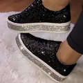 Detailed side view of black glitter platform sneakers with silver rhinestone-covered soles. - 35 / Black