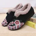 Elegant black winter slip-on shoes with floral embroidery and warm faux fur lining - 35 / Black