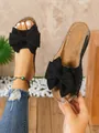 Schwarze Keilabsatz-Sandalen für Damen mit großer dekorativer Schleife und offener Zehe. - 36 / Schwarz
