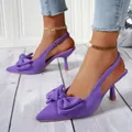 Detail view of purple French style pointed-toe high heel sandals with large bow decoration - 35 / Purple