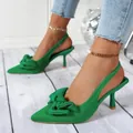 A close-up view of elegant green pointed-toe slingback heels with a stylish bow detail - 35 / Green