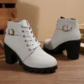 Detailed view of light grey block heel ankle boots with lace-up and buckle strap detail - 35 / Gray