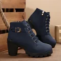 Detailed view of navy blue high-heel ankle boots with side zipper and buckle detail. - 35 / Blue